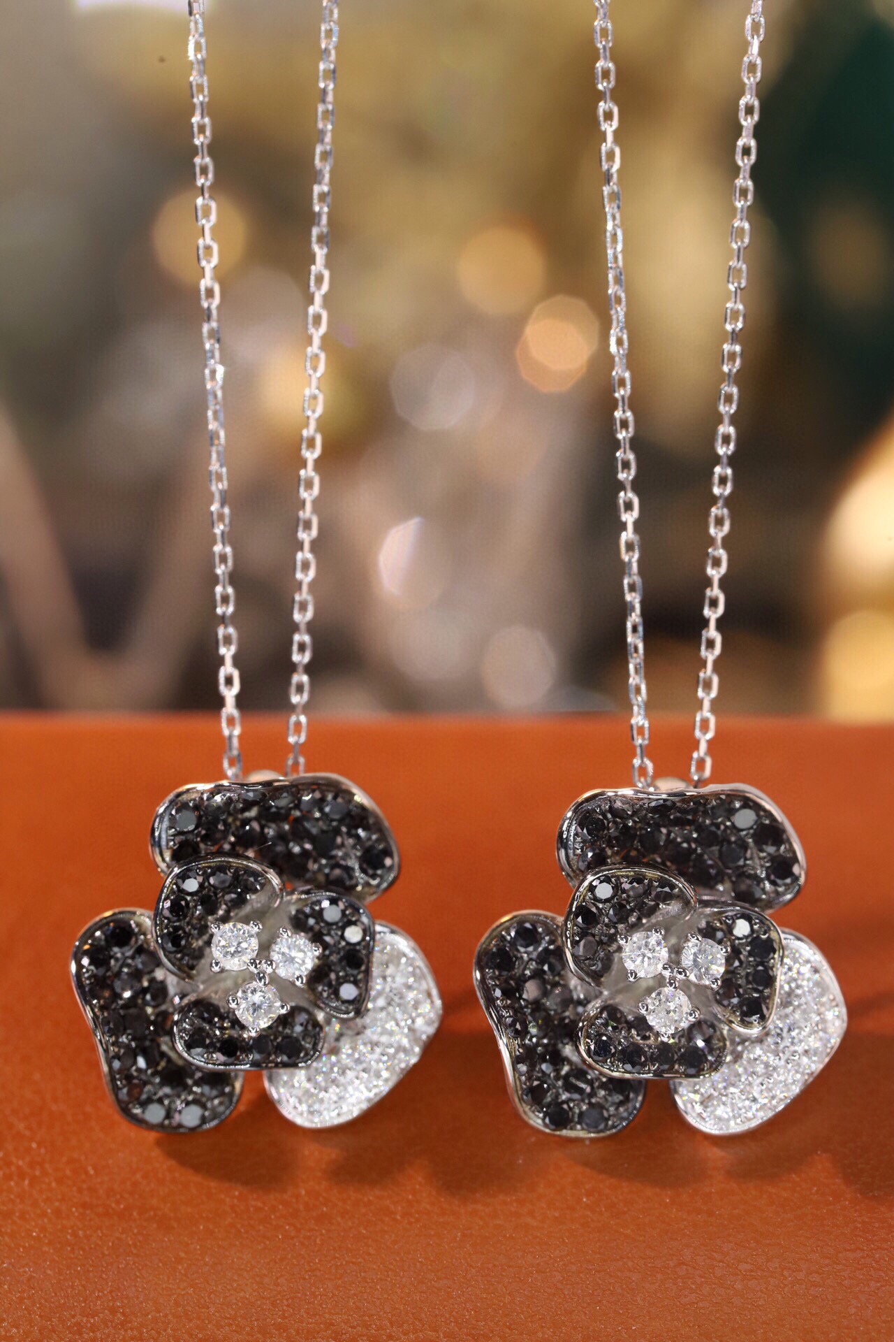 18k Gold Necklace with Flower Design, featuring a combination of black and white diamonds