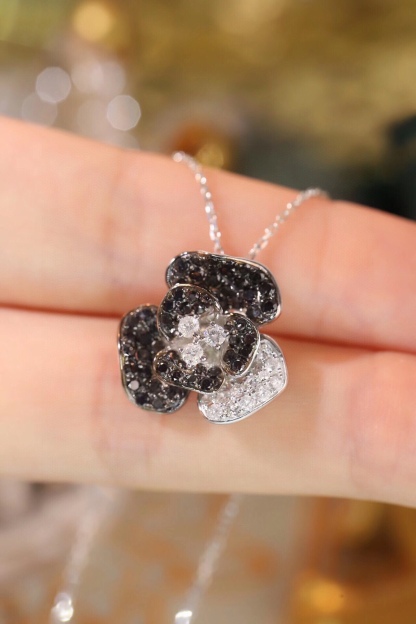 18k Gold Necklace with Flower Design, featuring a combination of black and white diamonds