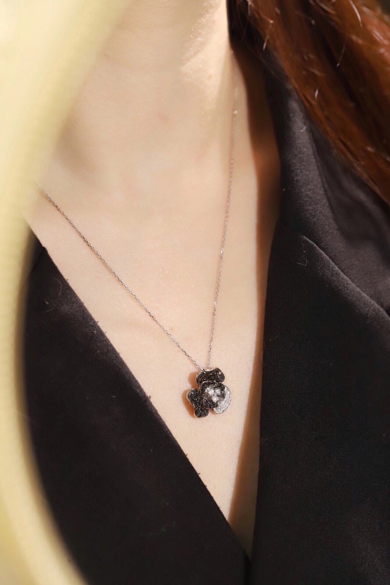 18k Gold Necklace with Flower Design, featuring a combination of black and white diamonds