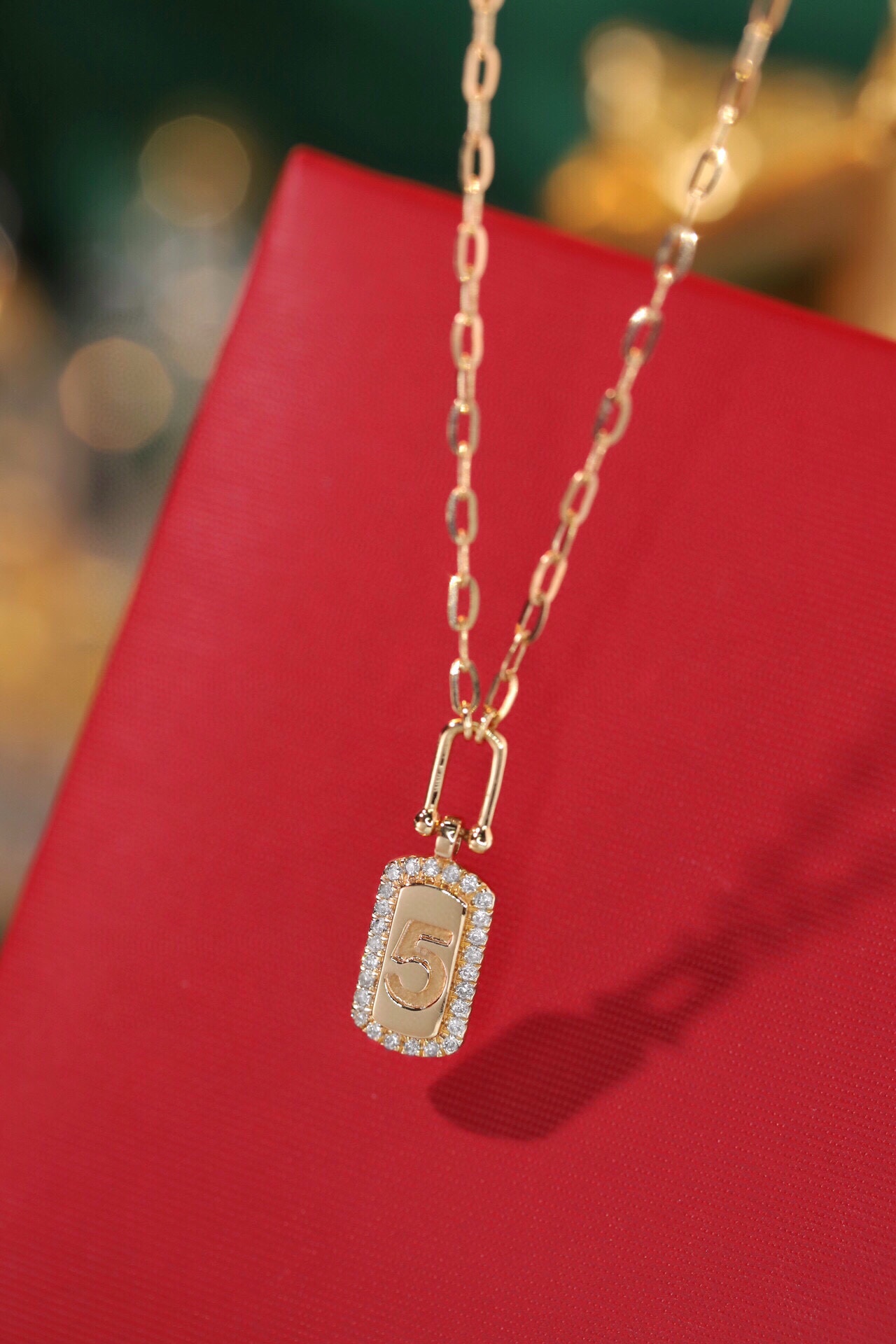 18k gold necklace with a gold-plated “5” and a 0.12ct natural diamond