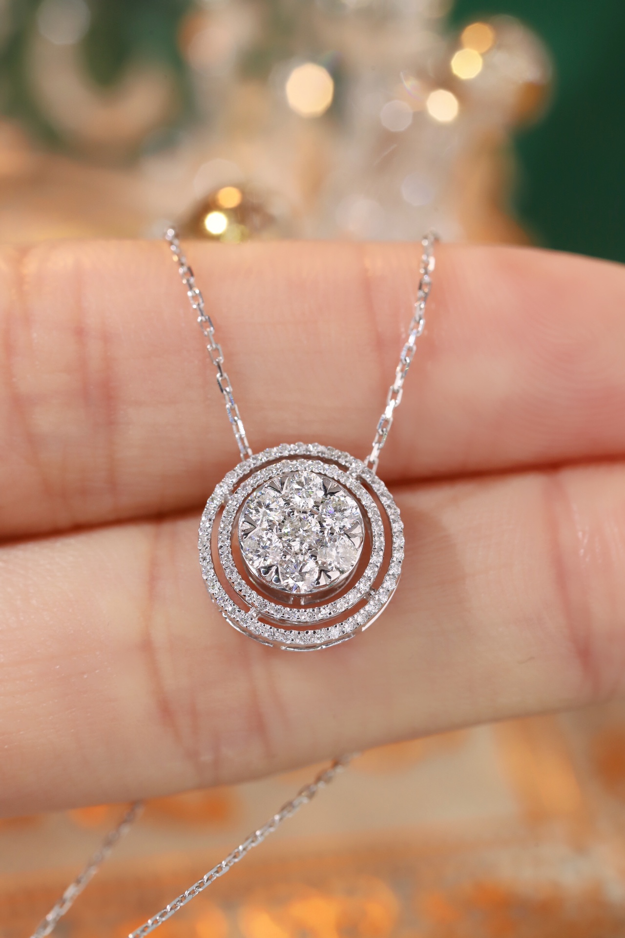 18K gold necklace with a round design; available in three wearing styles; features a 0.50-carat natural diamond setting.