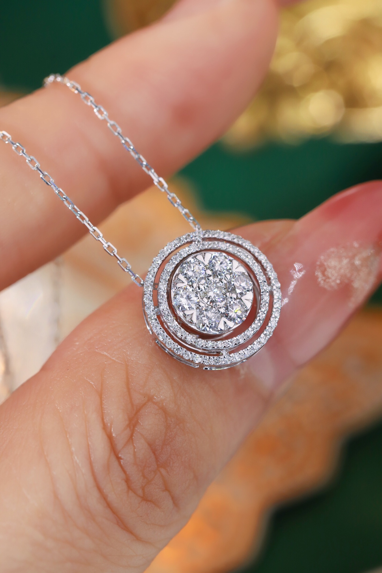 18K gold necklace with a round design; available in three wearing styles; features a 0.50-carat natural diamond setting.
