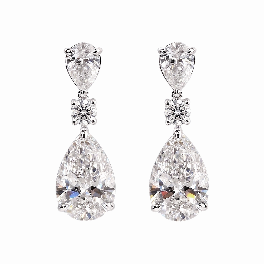 10k Gold Diamond Earrings: Droplet-cut 7.50ct Cultured Diamond, set in a three-prong design for an elegant look