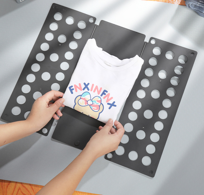 Clothing folding board