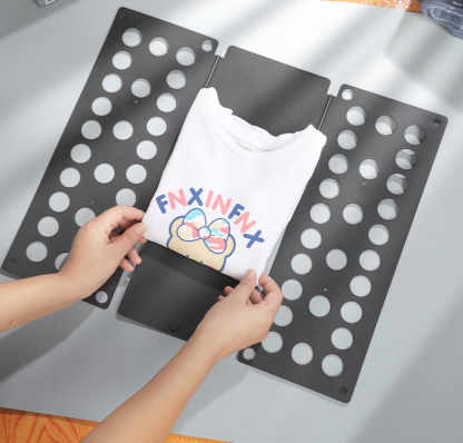 Clothing folding board