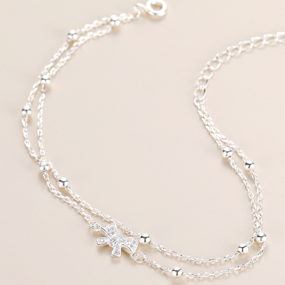Bow - Accented Silver Bracelet | Double - Layered Whimsy for Your Wrist