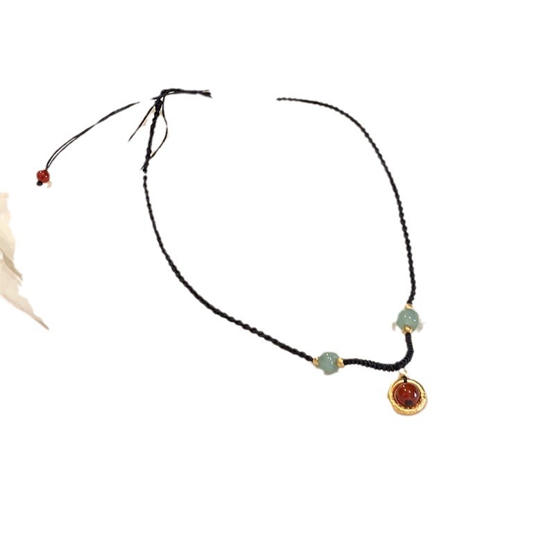 Black Cord as Paper, Gemstones as Ink—An Eastern Poem for the Neck