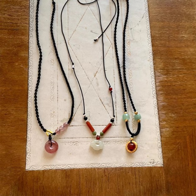 Black Cord as Paper, Gemstones as Ink—An Eastern Poem for the Neck