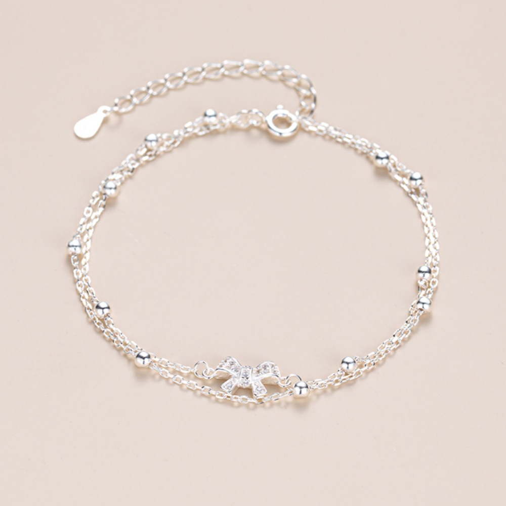 Bow - Accented Silver Bracelet | Double - Layered Whimsy for Your Wrist