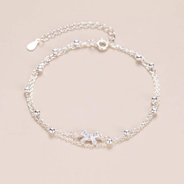 Bow - Accented Silver Bracelet | Double - Layered Whimsy for Your Wrist