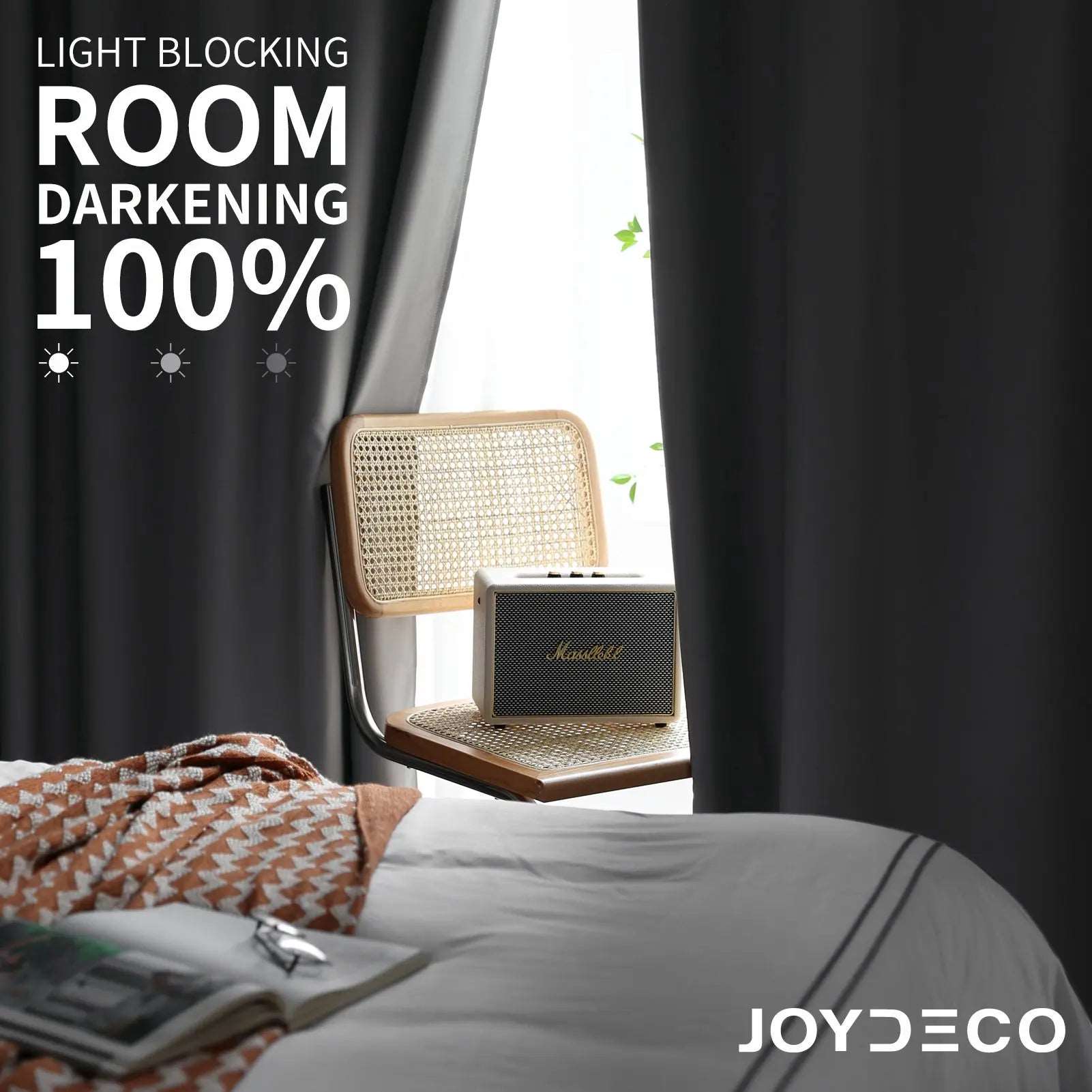 Joydeco dark grey polyester blackout curtains with grommets, showcasing 100% light blocking for a bedroom or living room.
