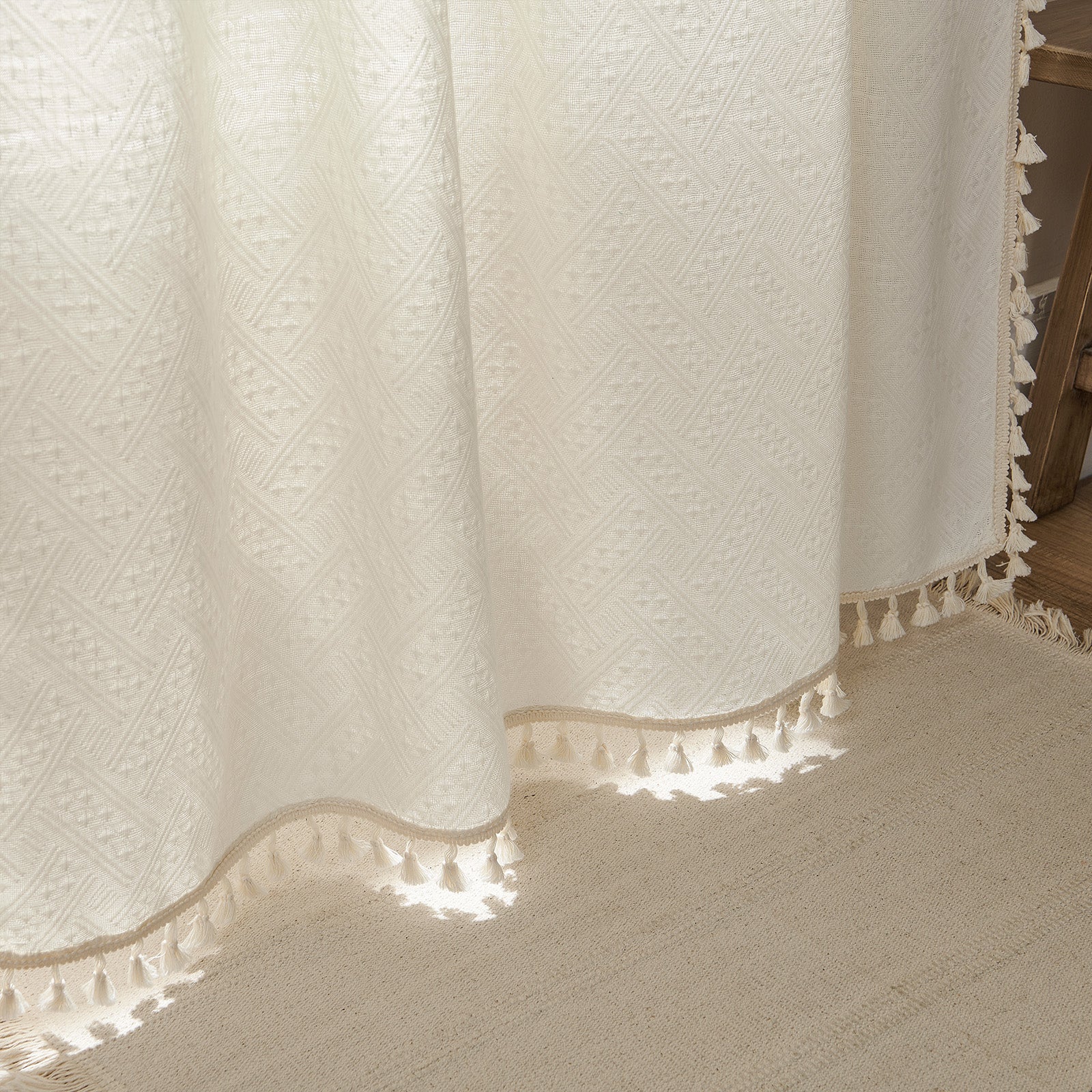 Joydeco cream boho curtains with basketweave texture, diamond pattern, and cream tassel trim.