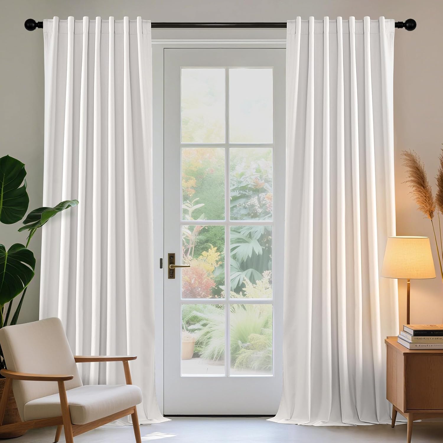 Joydeco pure white linen blackout curtains framing a glass door, 96 inches long, shown in a living room with garden view.