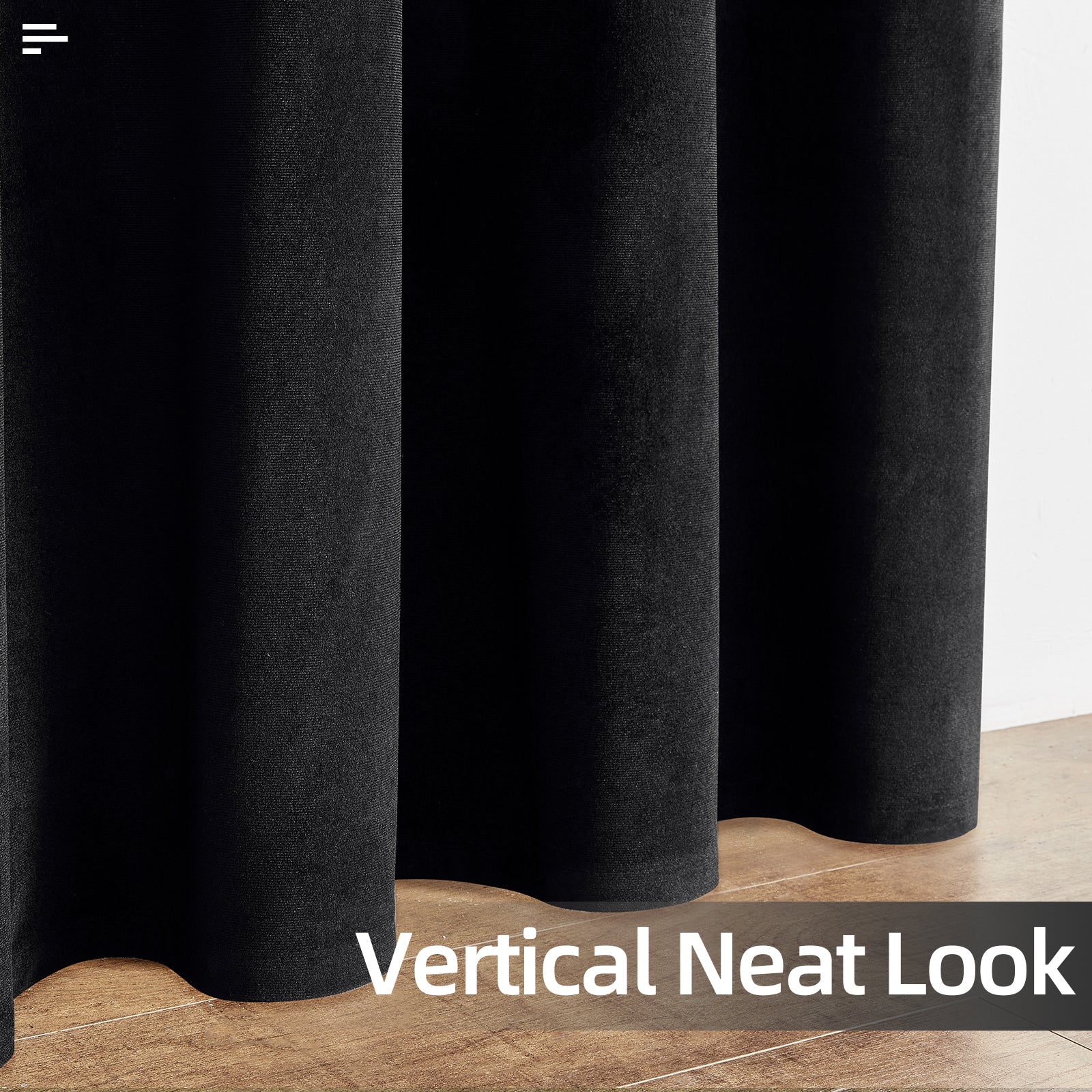 Close-up of three black velvet blackout curtain panels, showcasing plush texture and neat drape, on a wooden floor.