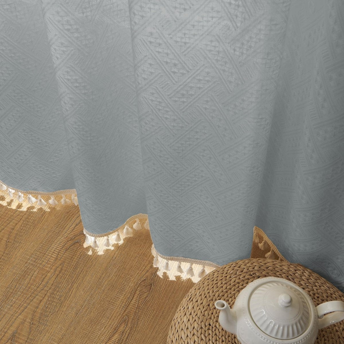 Joydeco Stone Blue linen sheer curtain detail with woven geometric pattern and cream tassel trim, farmhouse style.