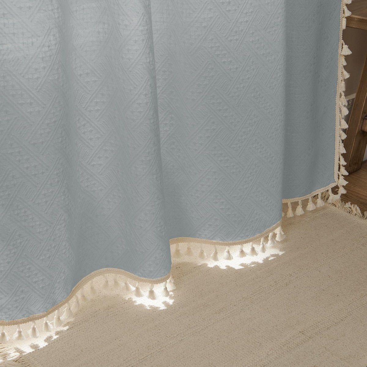 Joydeco Stone Blue linen sheer curtain close-up showing woven geometric pattern and cream tassels, farmhouse style.