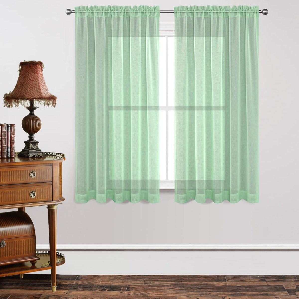 Joydeco mint green sheer curtains, 2 panels, dual rod pocket, room setting.