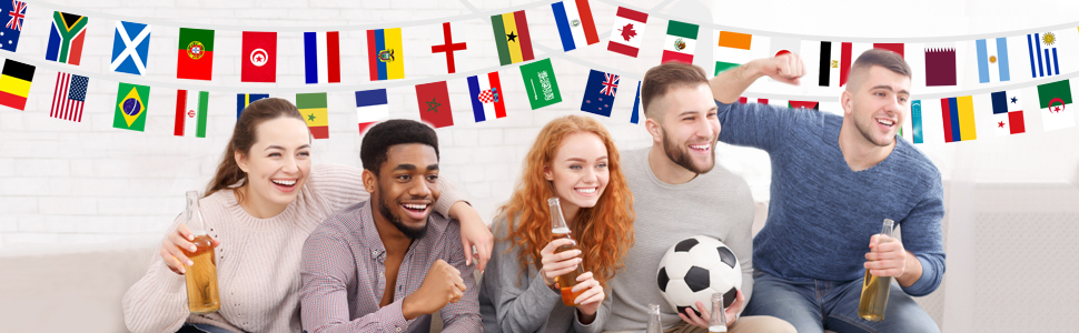 String of colorful international flags arranged in a row, showing various national flags in miniature format against a dark background.