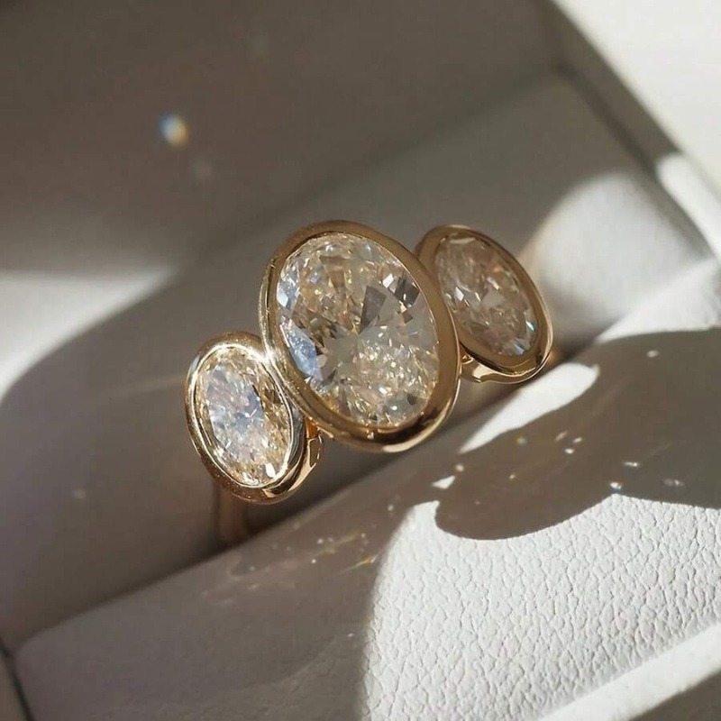 Gilded Circle Harmony 18K Gold Bezel-Set Three-Stone Ring