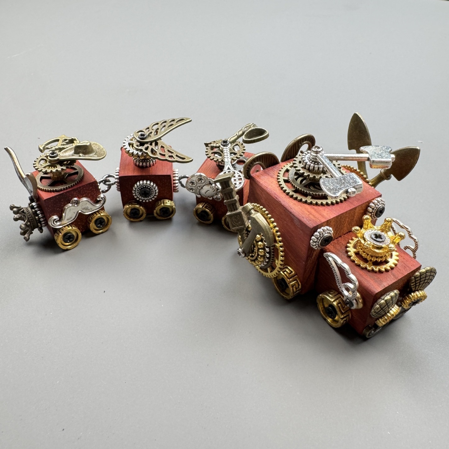 A versatile accessory that works as both a phone charm and a necklace pendant.