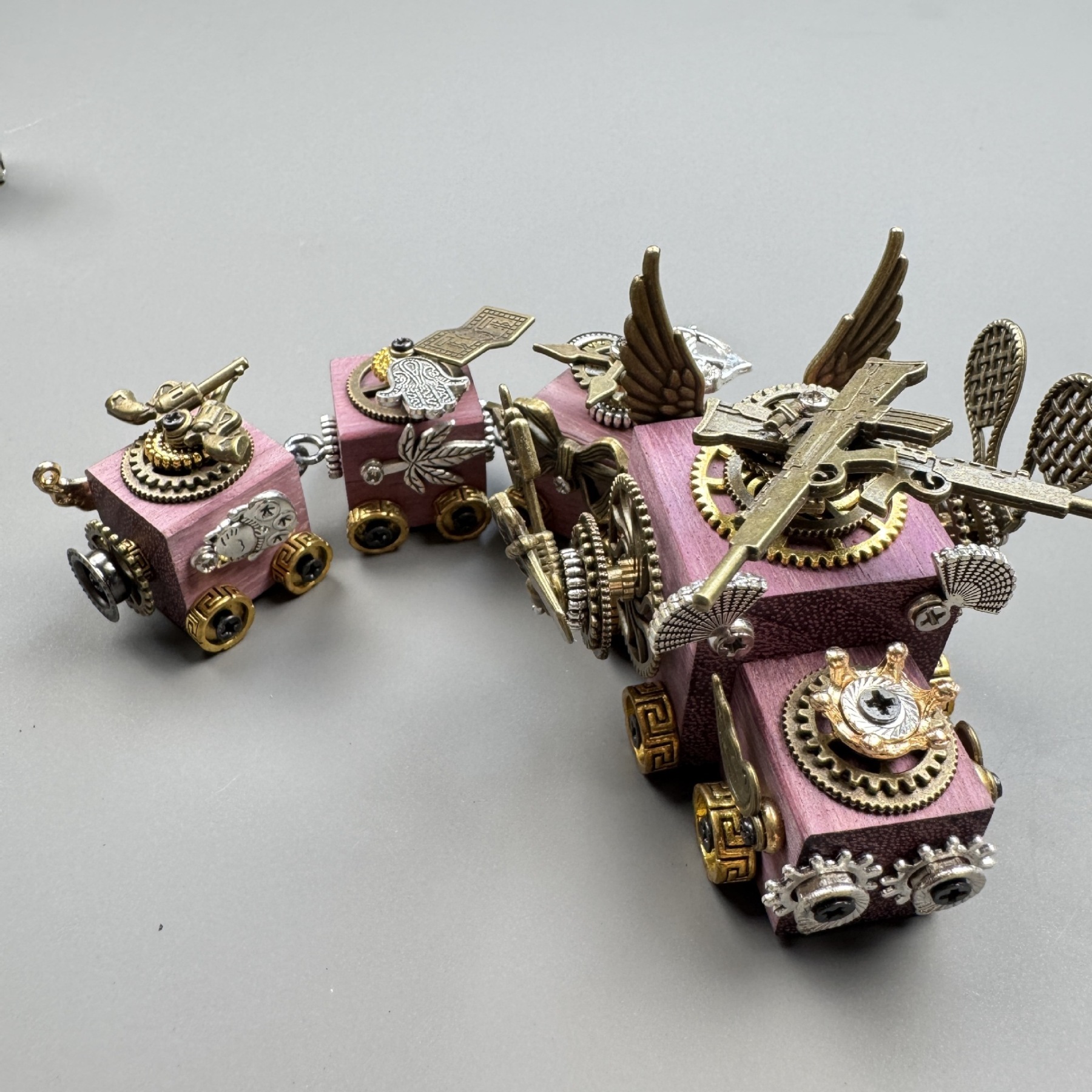 A versatile accessory that works as both a phone charm and a necklace pendant.