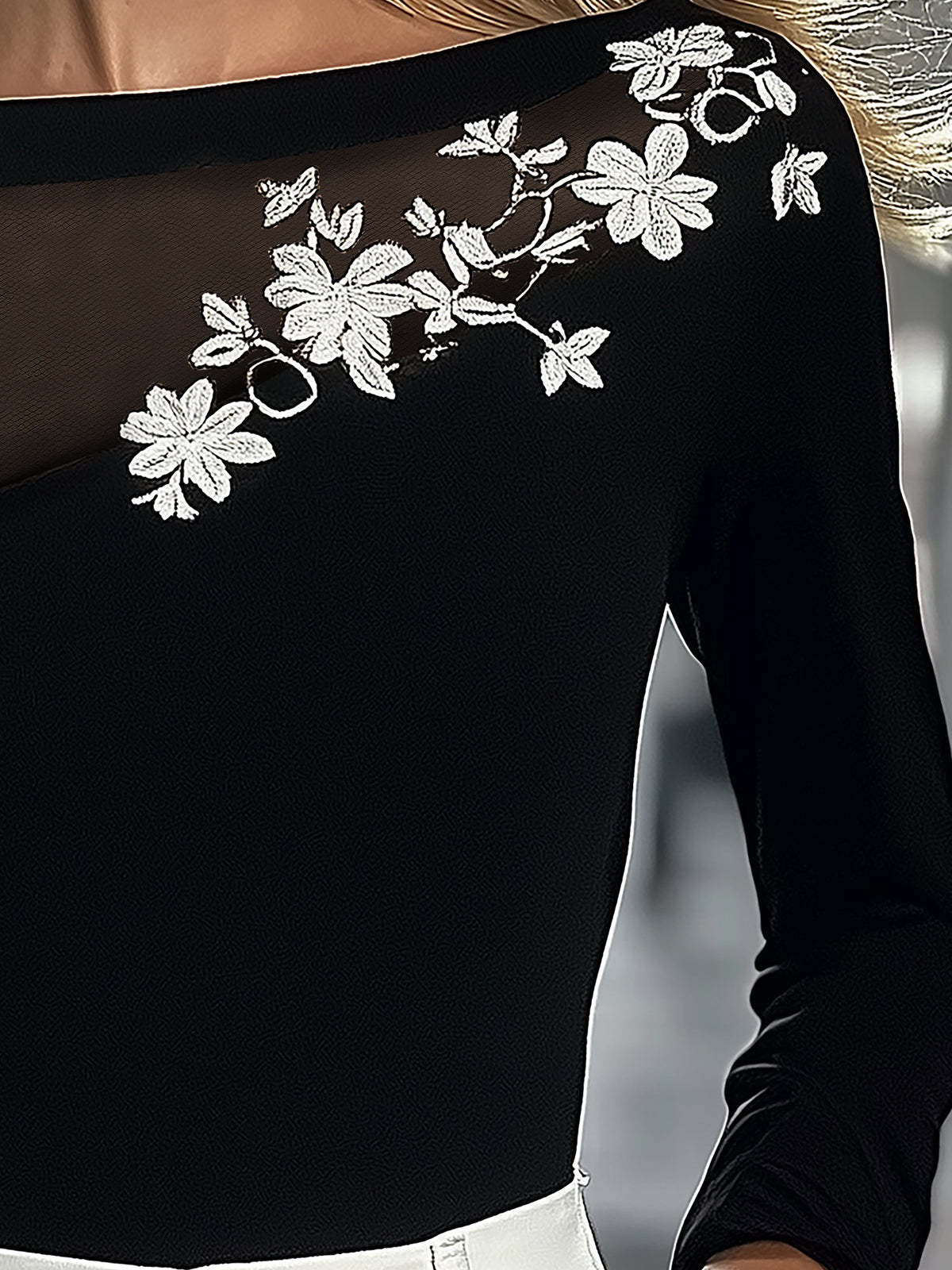 Black Top With Mesh Neckline And Floral Embroidery