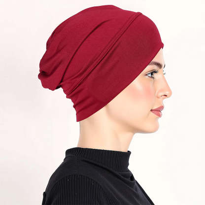 Smart och stretchig under-scarf mössa för en slät och bekväm frisyr hela dagen