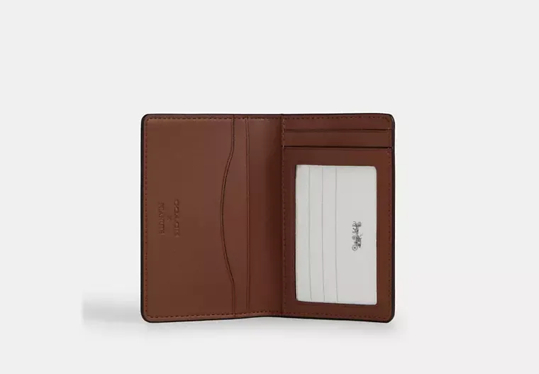 Coach X Peanuts Id Card Wallet In Signature Canvas With Snoopy Print