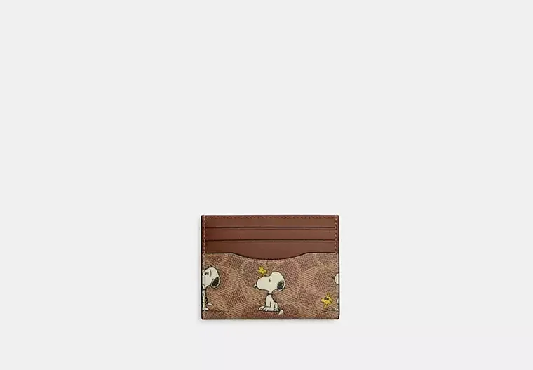 Coach X Peanuts Slim Id Card Case In Signature Canvas With Snoopy Print
