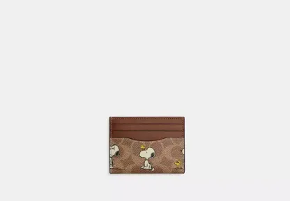 Coach X Peanuts Slim Id Card Case In Signature Canvas With Snoopy Print