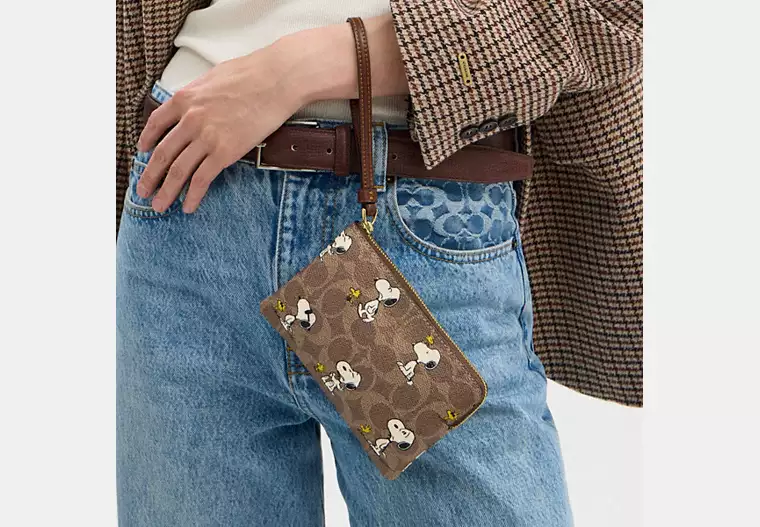 Coach X Peanuts Corner Zip Wristlet In Signature Canvas With Snoopy Print