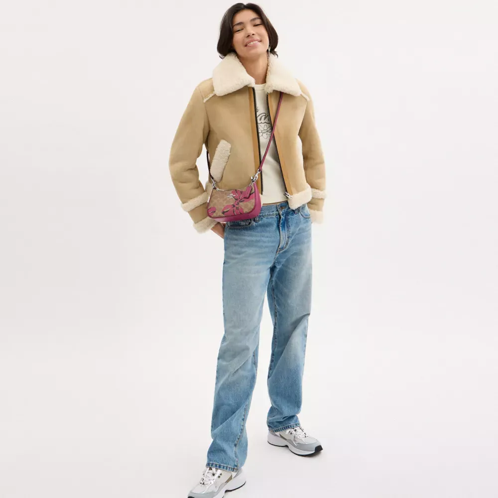 Teri Mini Crossbody Bag In Signature Canvas With Bow Print