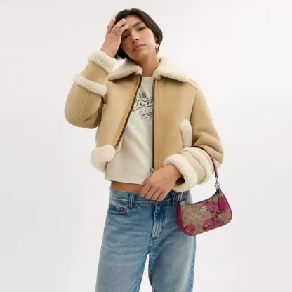 Teri Mini Crossbody Bag In Signature Canvas With Bow Print