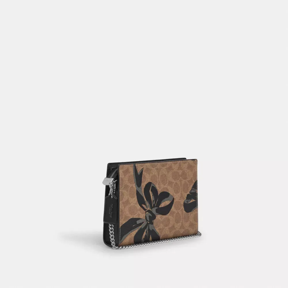 Slim Crossbody Bag In Signature Canvas With Bow Print