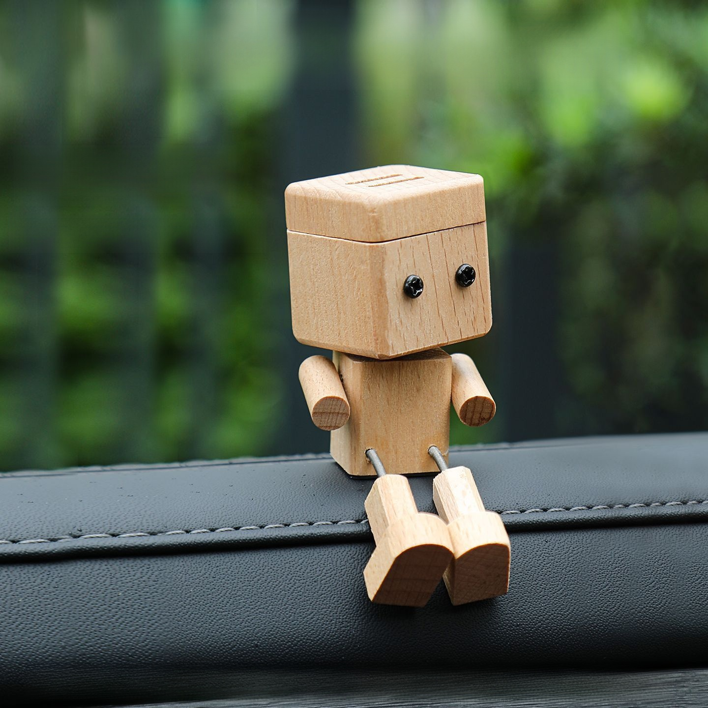 ✨ [Viral On Social Media] ✨ Premium Handcrafted Solid Wood Car Aromatherapy Robot with swinging legs and premium forest scent for the ultimate cute and stress-free driving vibe 🚗