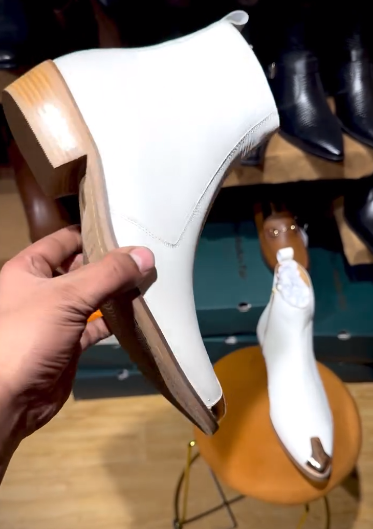 Handcrafted metal-toed white ankle boots