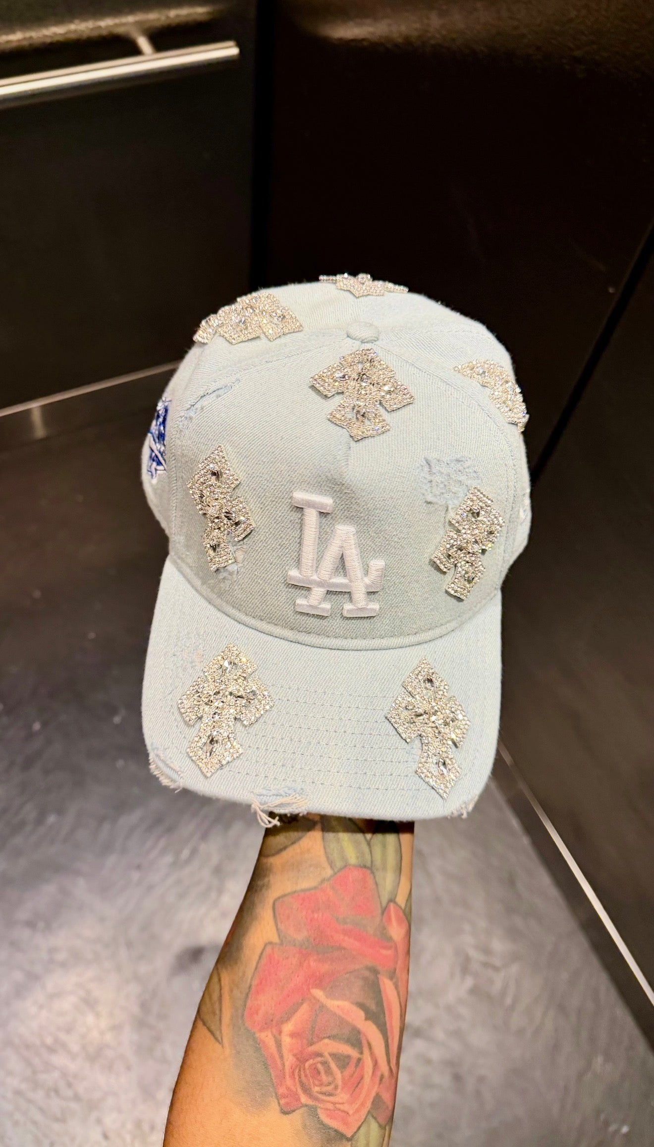 Light-washed denim hat with cross decoration