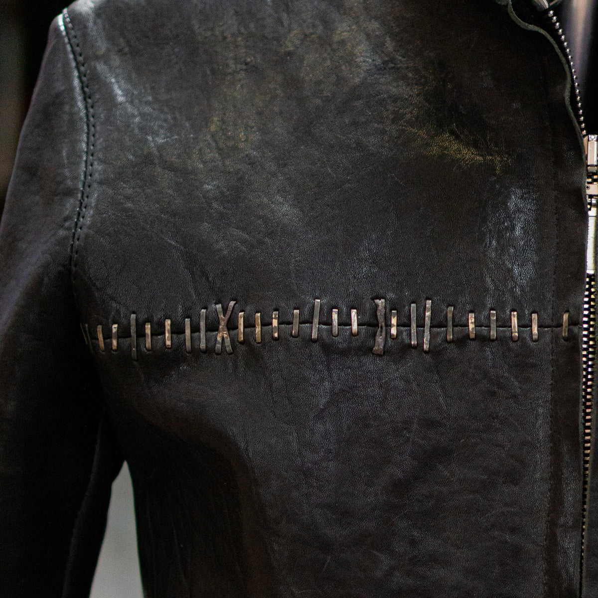 Hand-stapled leather jacket
