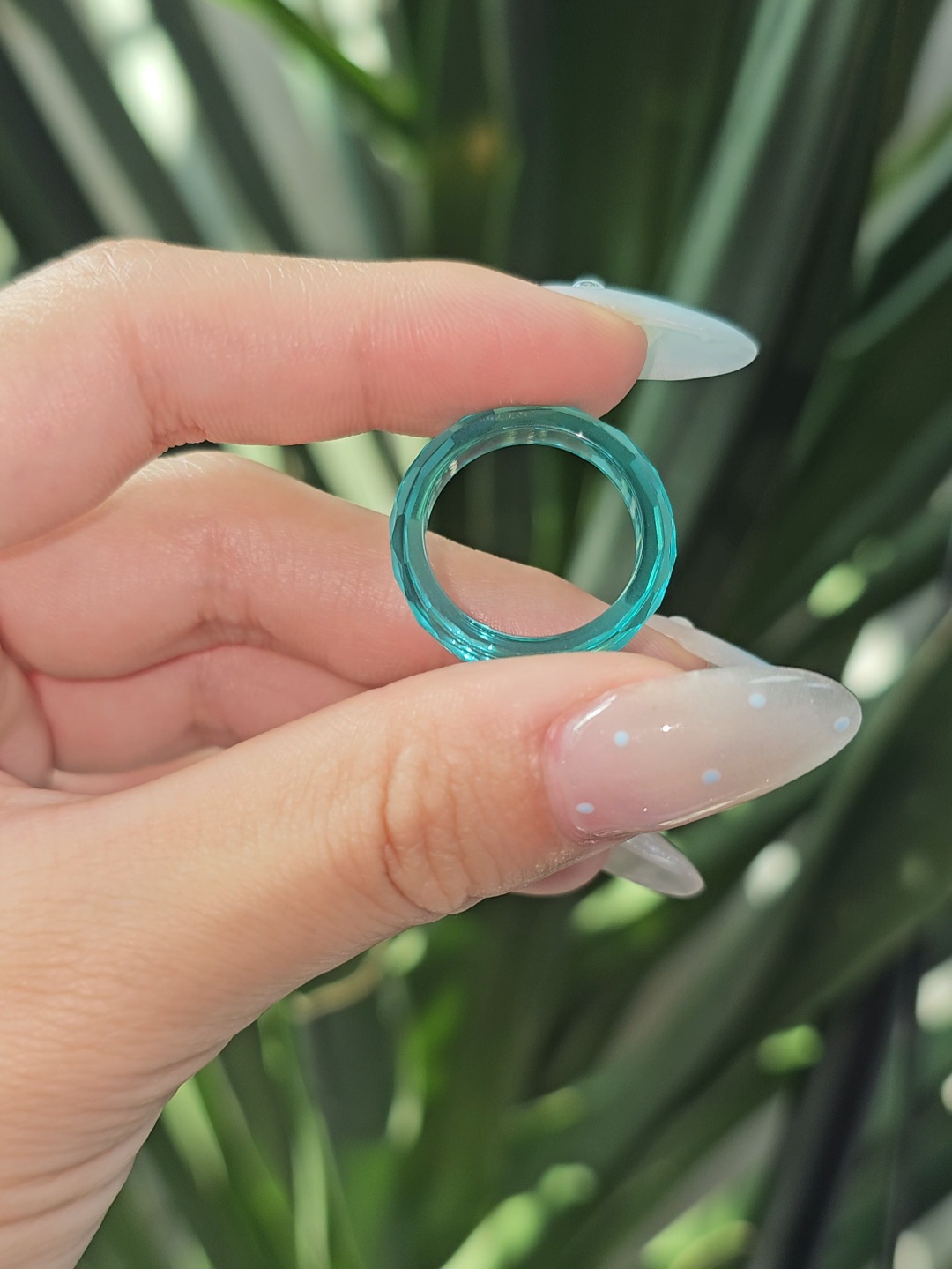 Paraiba YAG faceted solitaire ring.