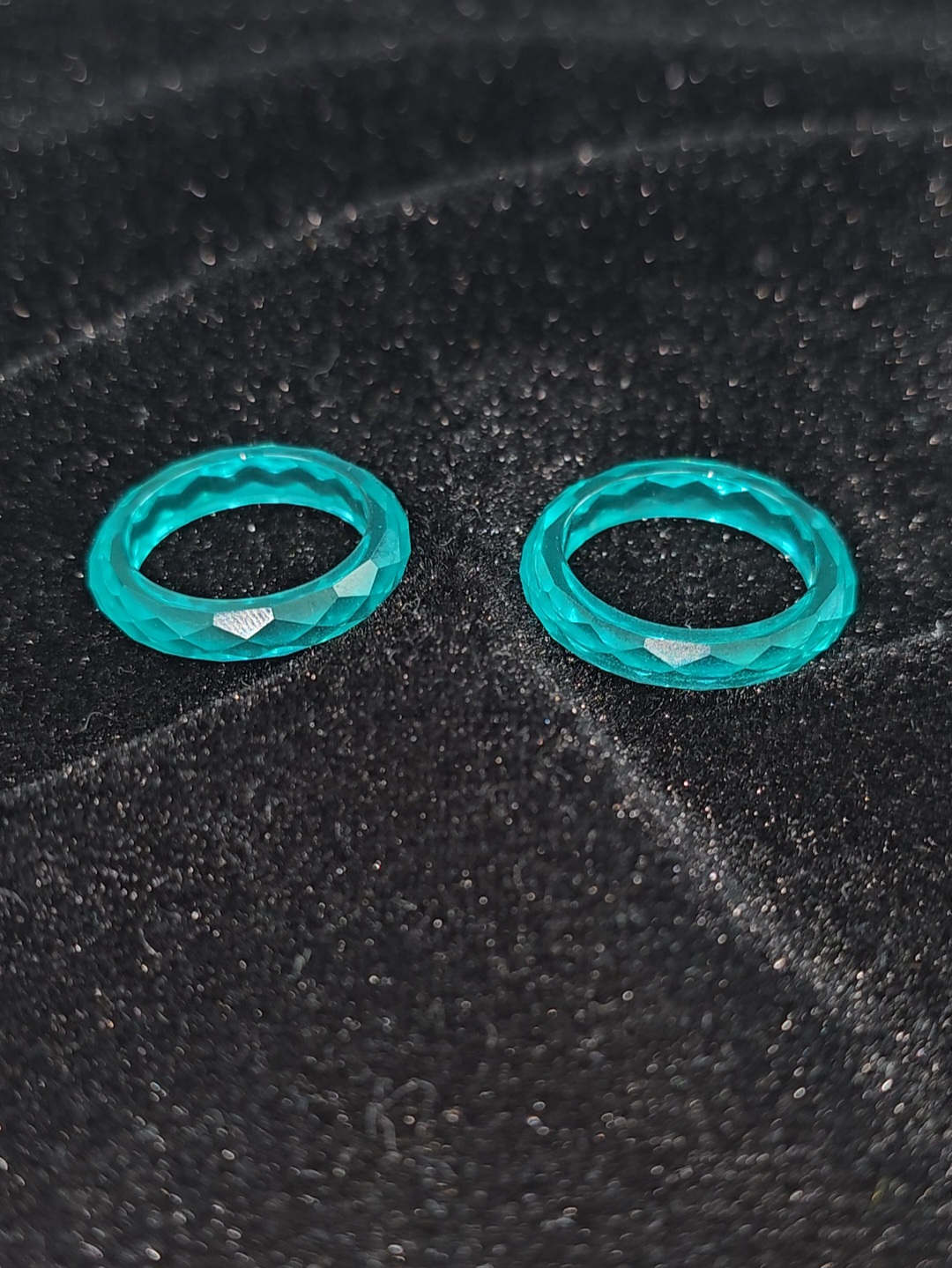 Paraiba YAG faceted solitaire ring.