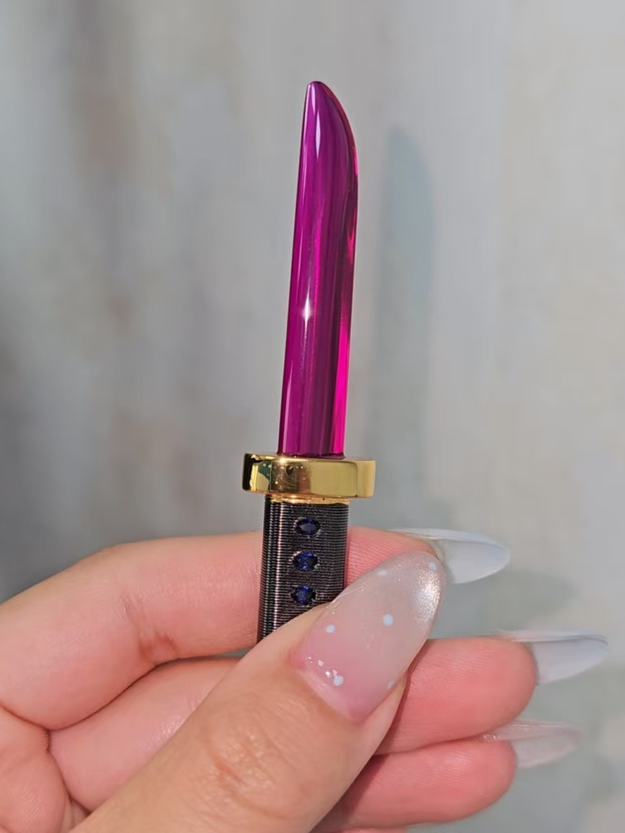 A delicate gemstone cultivation knife pendant.