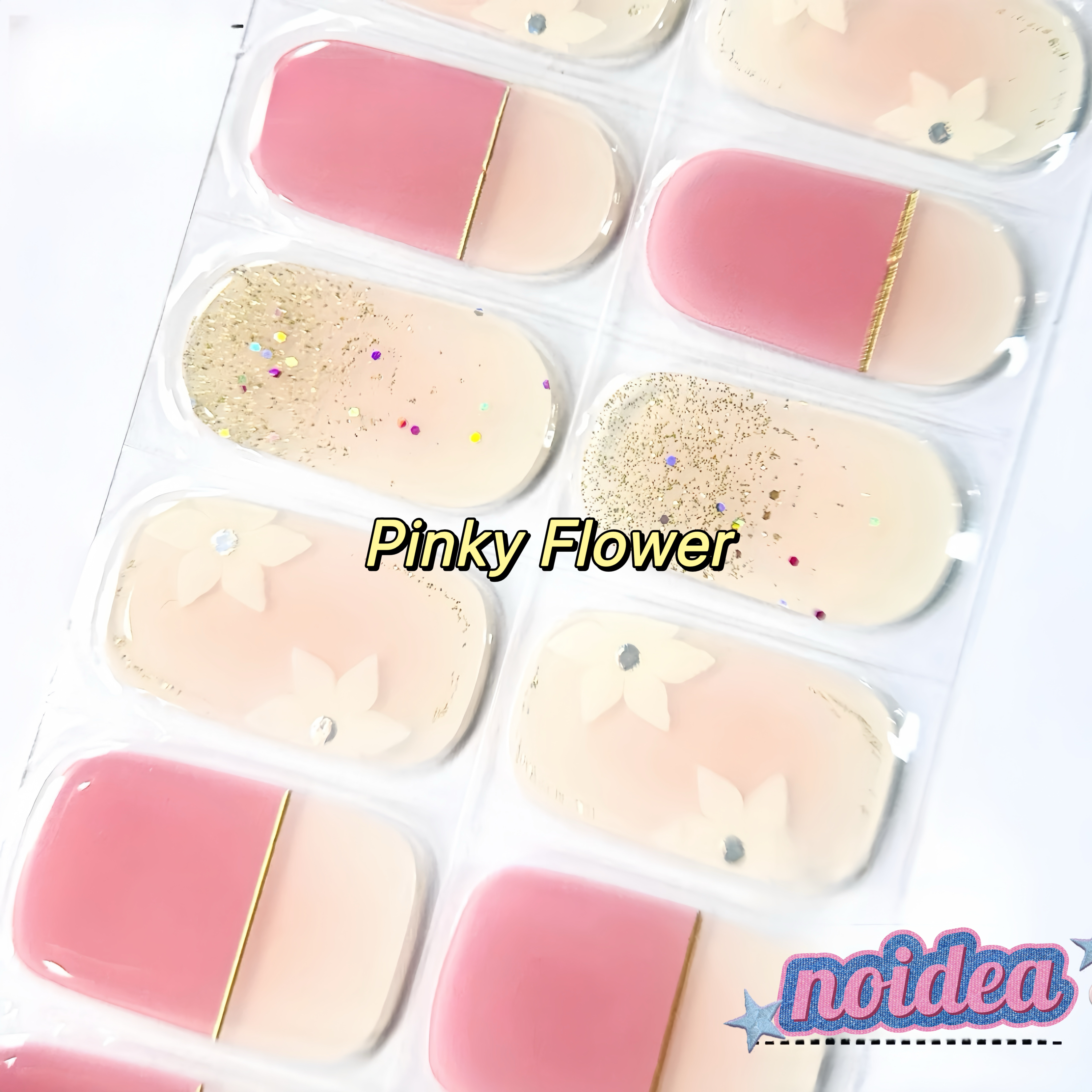A flat lay of a sheet with 20 pink and white floral gel nail stickers