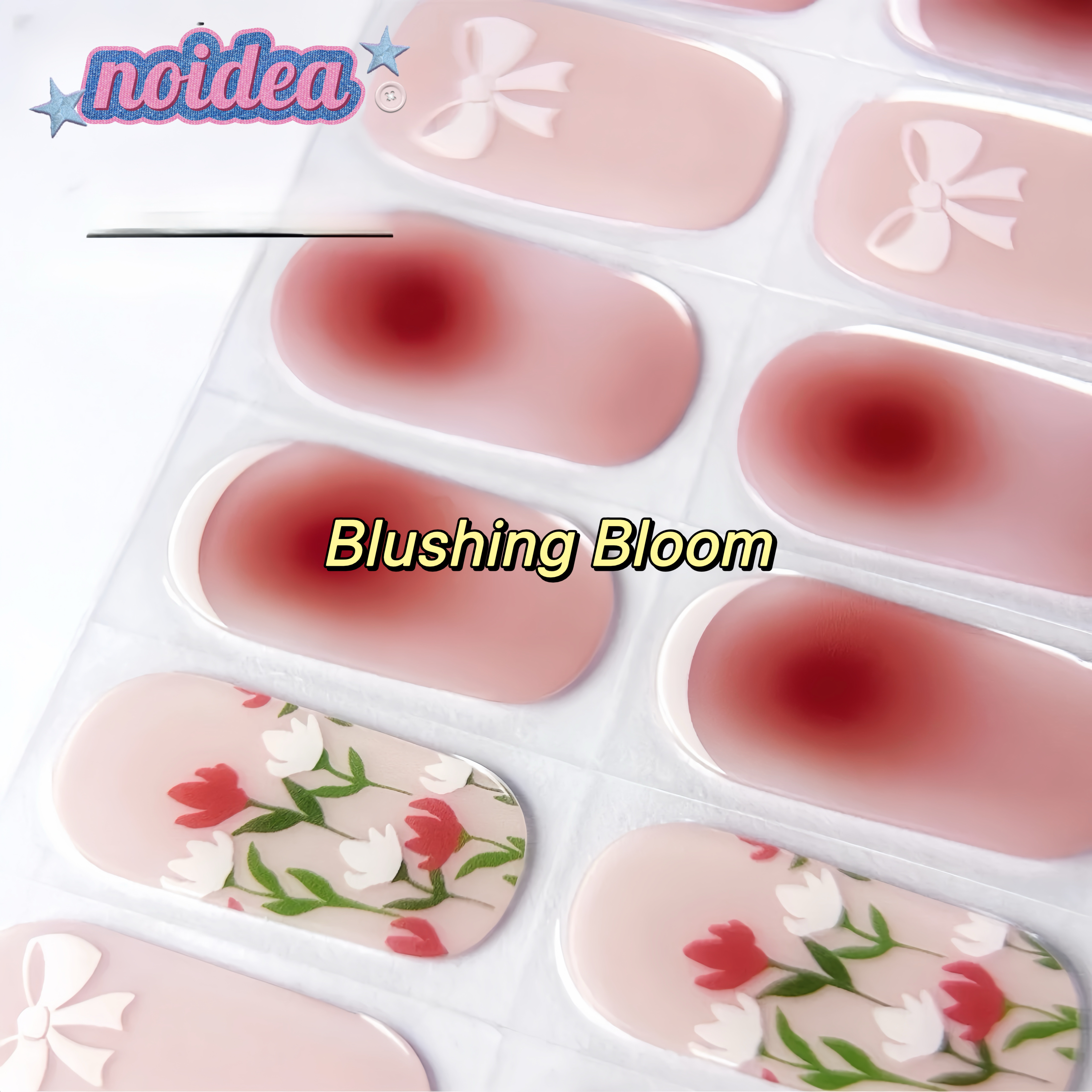 A flat lay of a sheet with 20 pink and white floral gel nail stickers on pink base