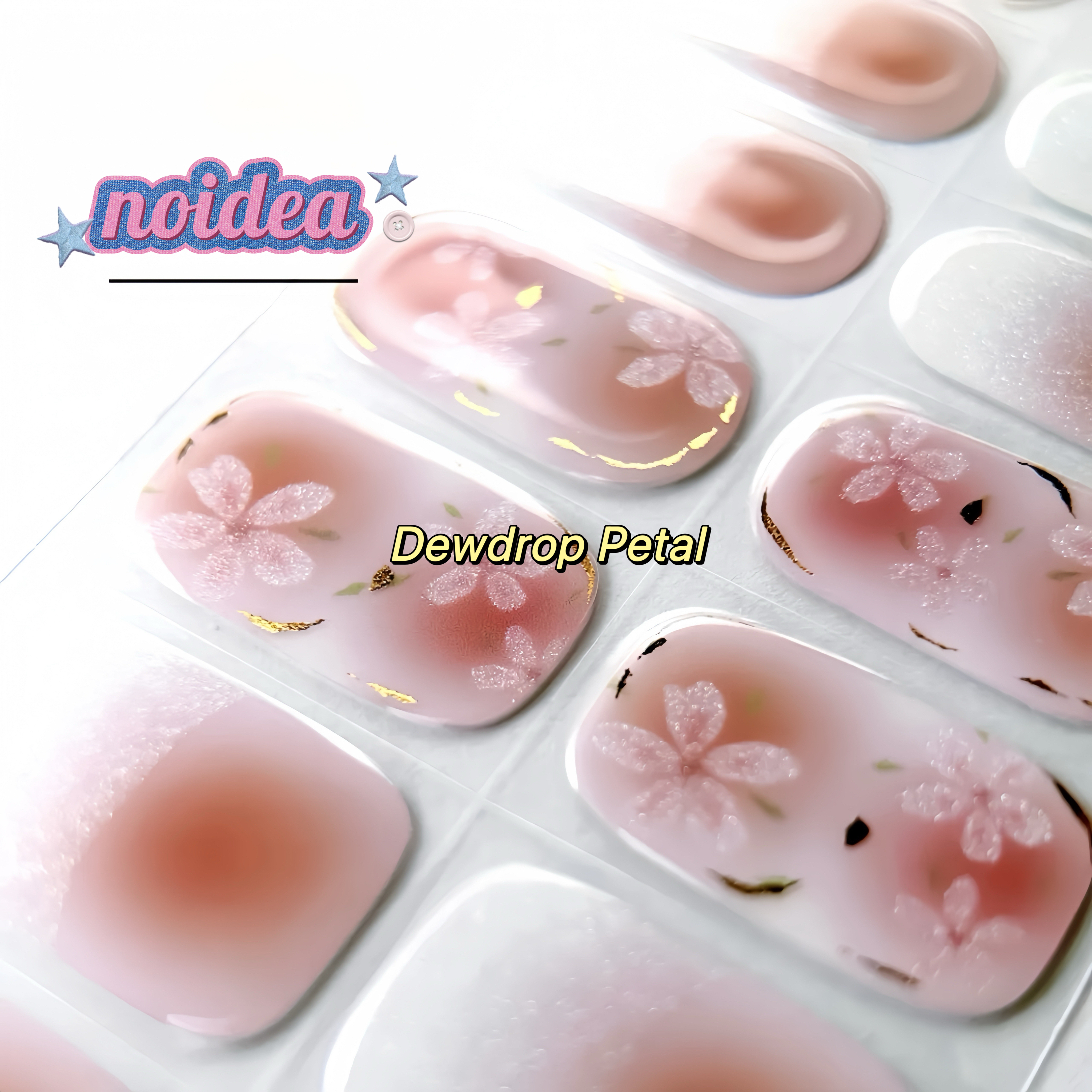 A flat lay of a sheet with 20 shining pink and white floral gel nail stickers