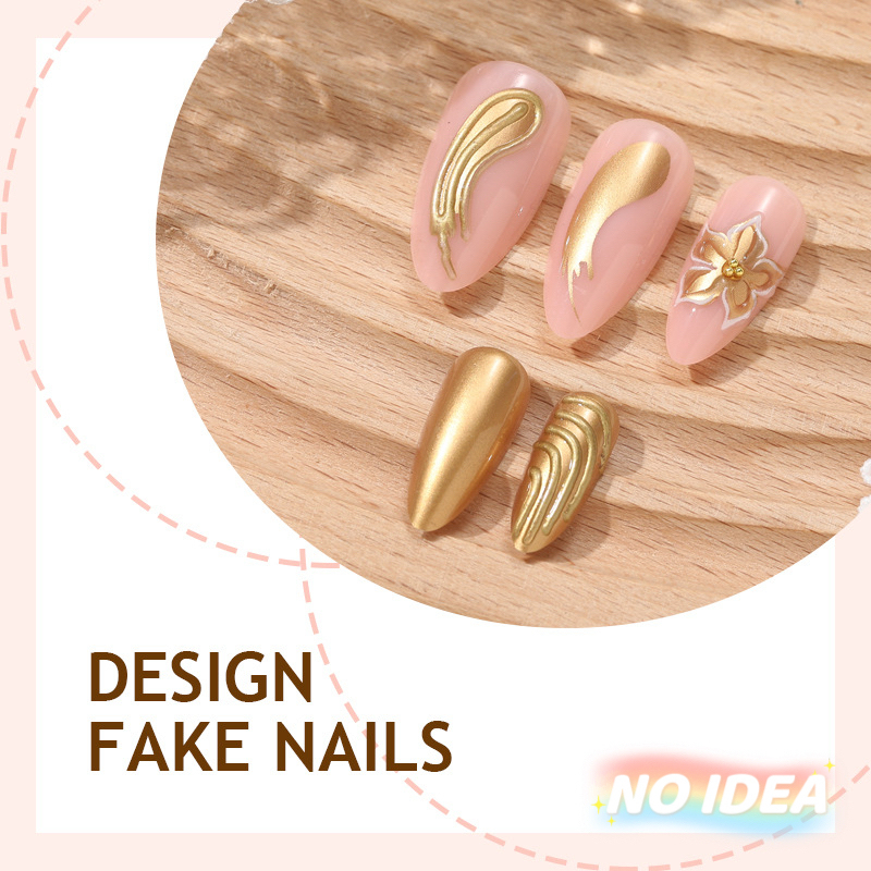 Almond shaped nude pink nails with delicate gold/silver metallic line art forming floral patterns.