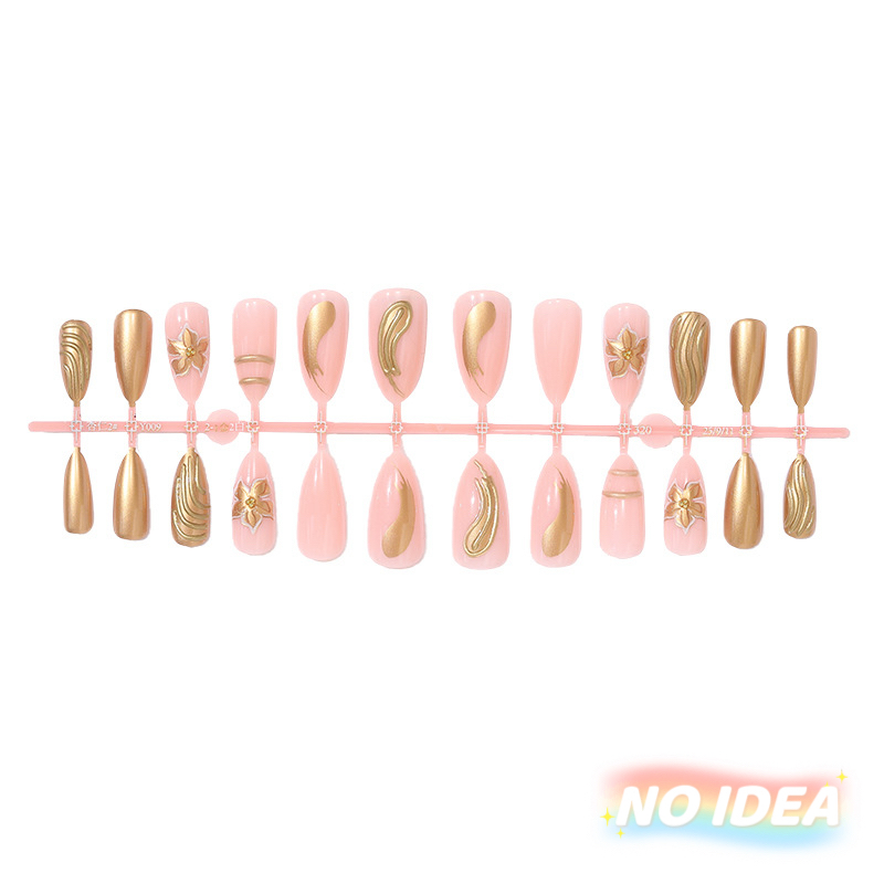 Almond shaped nude pink nails with delicate gold/silver metallic line art forming floral patterns.