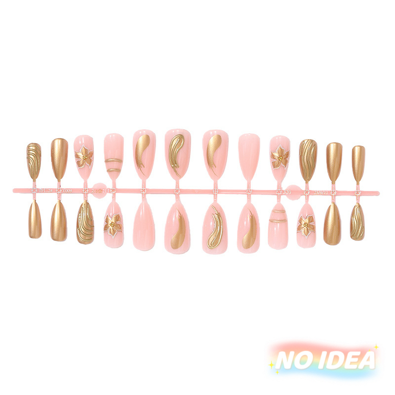 Almond shaped nude pink nails with delicate gold/silver metallic line art forming floral patterns.