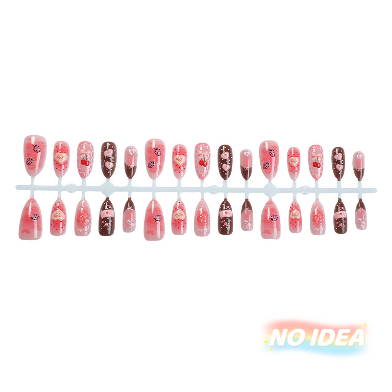 Sweet pink almond shaped nails with cute strawberry, cherry, heart, and bow illustrations.