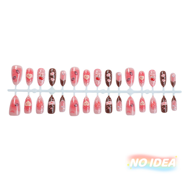 Sweet pink almond shaped nails with cute strawberry, cherry, heart, and bow illustrations.