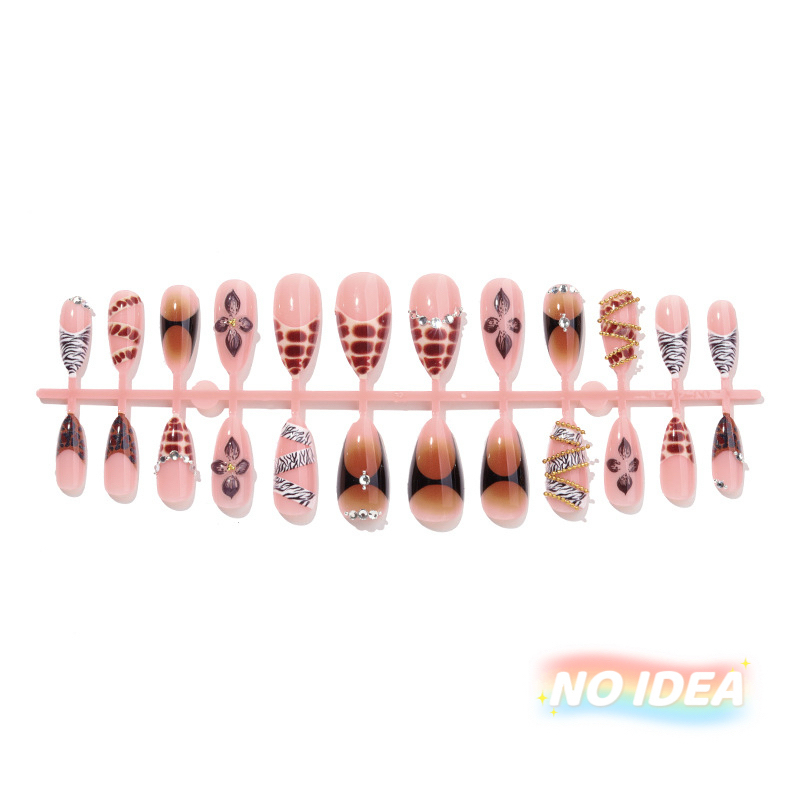 Almond shaped nude press on nails with a classic black zebra print stripe.